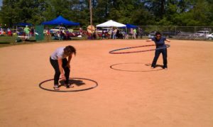 Hula hooping on the ball field.