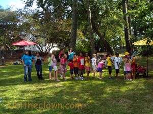 Children and parents waiting for a balloon animal at Sunday in the Garden, sponsored by the Arts Council of Wayne County.
