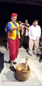 The snake charmer in action. (Live video nearby.)