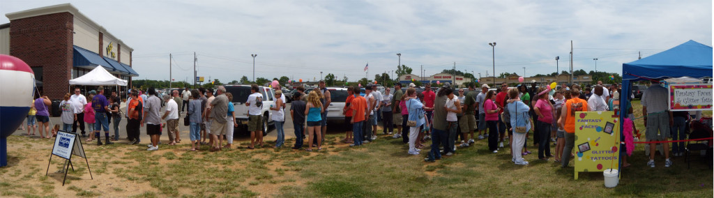 People waiting in line to get an autograph from the Lizard Lick Towing and Recovery team at the Lee, Inc., birthday celebration in Mount Olive, NC.