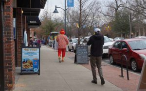 Bopping down the street.